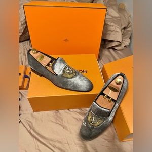 Louis Vuitton men’s Silver Pony hair loafers.